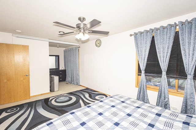 unfurnished bedroom with ceiling fan and light colored carpet