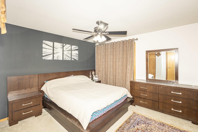 bedroom with ceiling fan and light colored carpet