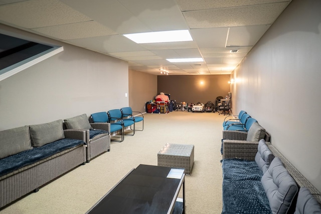 interior space featuring carpet and a drop ceiling