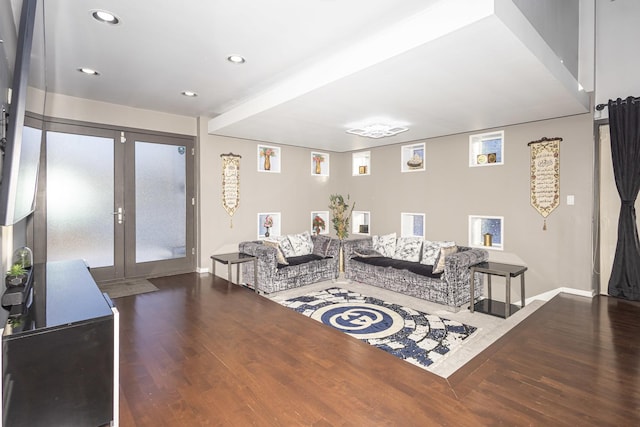 living room with french doors and dark hardwood / wood-style floors