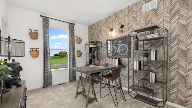 dining area featuring light carpet