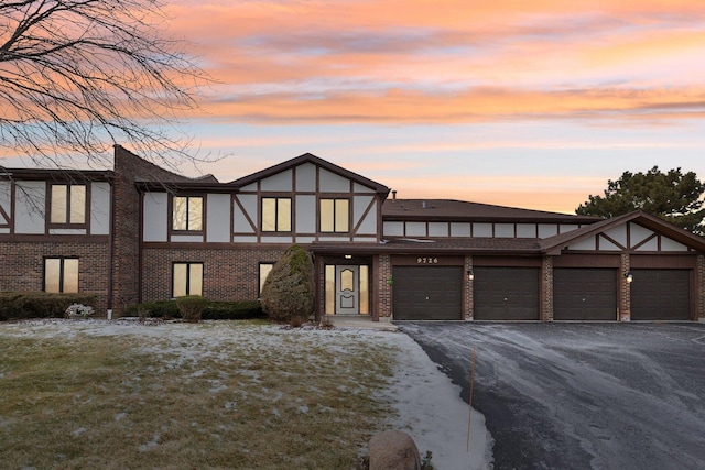 tudor home featuring a garage