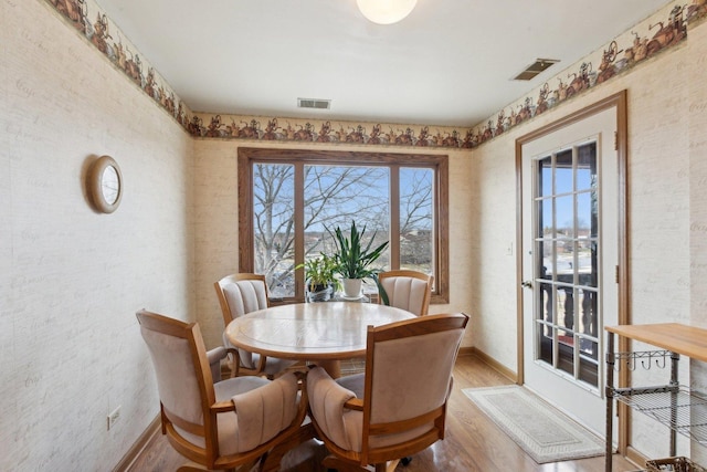 dining area featuring light wood-type flooring