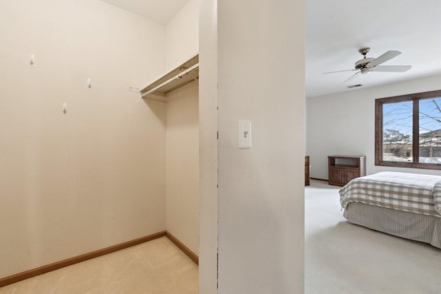 bedroom with light colored carpet and ceiling fan