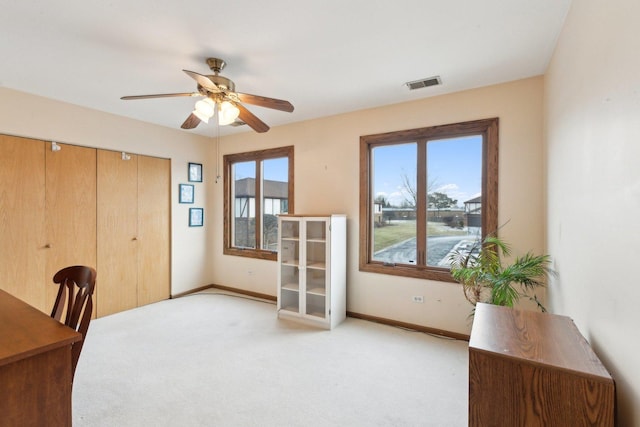 office area featuring ceiling fan and light colored carpet