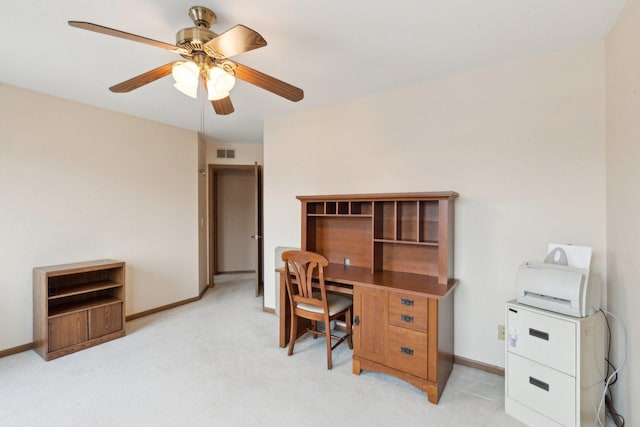 office space with ceiling fan and light carpet