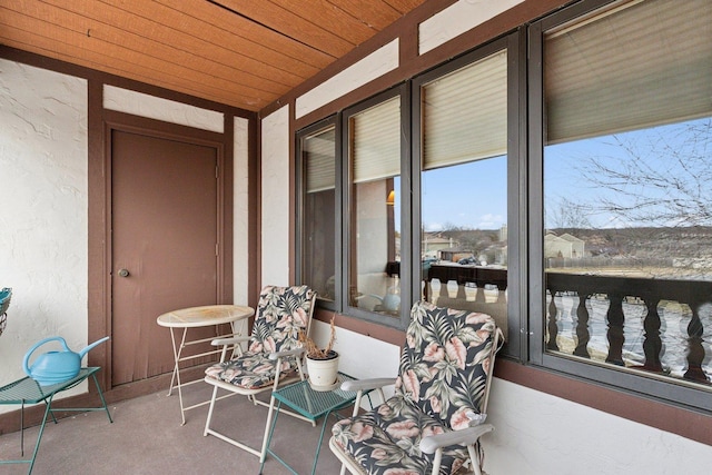 sunroom featuring wooden ceiling