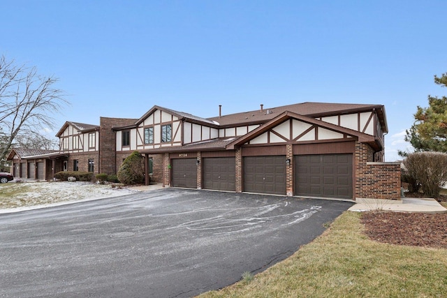 tudor home featuring a garage