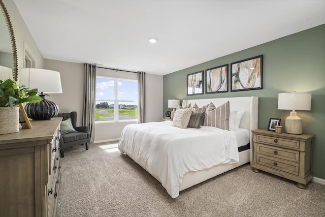 bedroom with light colored carpet