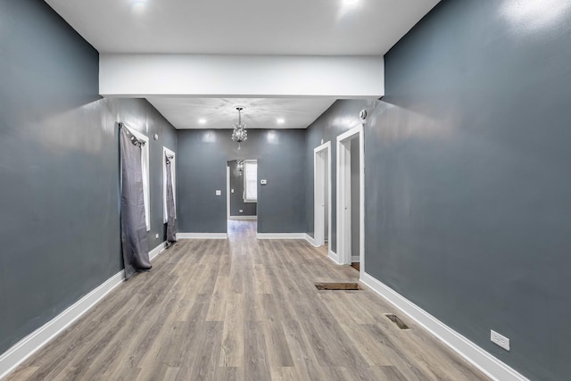 interior space featuring a notable chandelier and light hardwood / wood-style floors