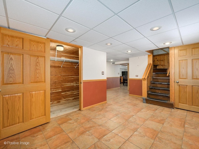 interior space featuring wooden walls