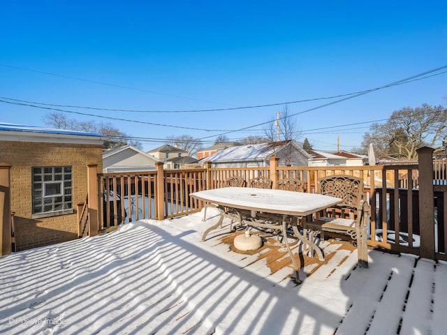 view of snow covered deck