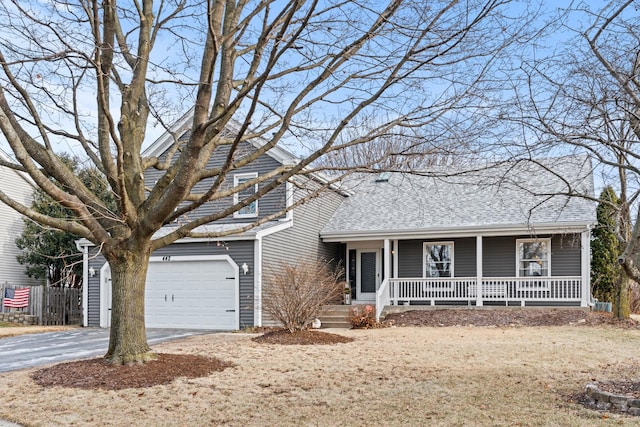 front of property with covered porch and a garage