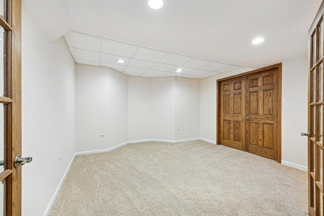 interior space with carpet floors, recessed lighting, and baseboards