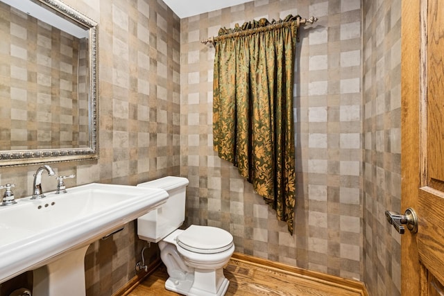 bathroom with visible vents, a sink, tile walls, and toilet