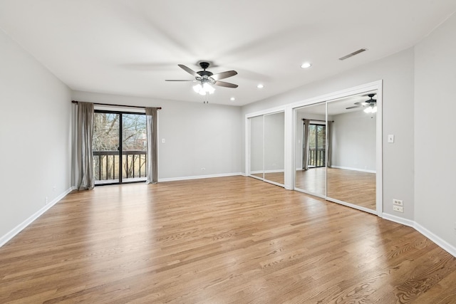 spare room featuring recessed lighting, light wood-type flooring, visible vents, and baseboards