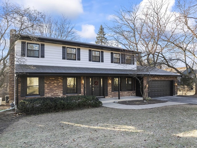 view of front of home with a porch and a garage