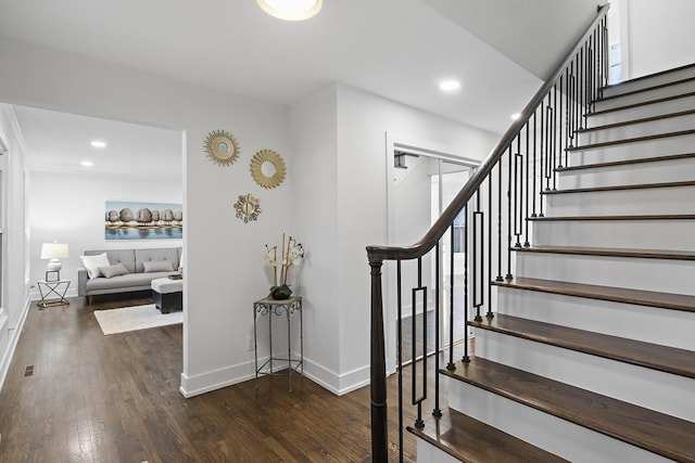 staircase featuring hardwood / wood-style floors