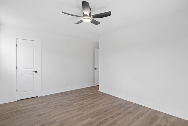 unfurnished room featuring light hardwood / wood-style flooring and ceiling fan