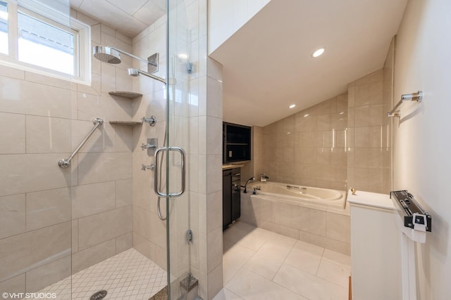 bathroom with vaulted ceiling, tile patterned floors, and shower with separate bathtub