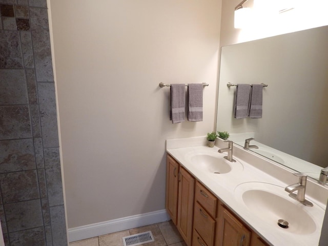 bathroom with vanity and tile patterned floors