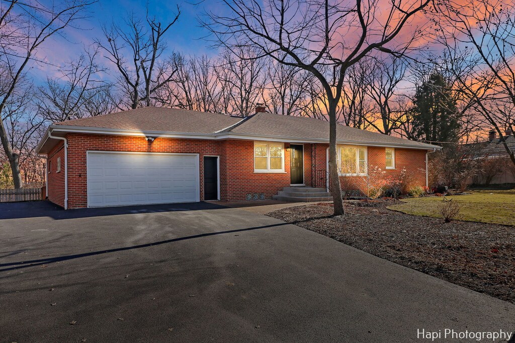 ranch-style home featuring a garage