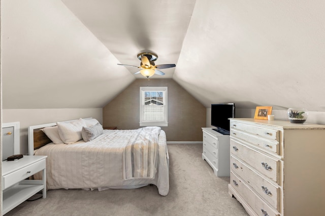 carpeted bedroom featuring ceiling fan and lofted ceiling