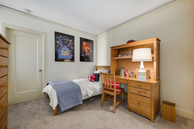 carpeted bedroom featuring crown molding