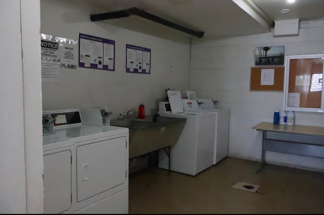 washroom featuring separate washer and dryer and sink