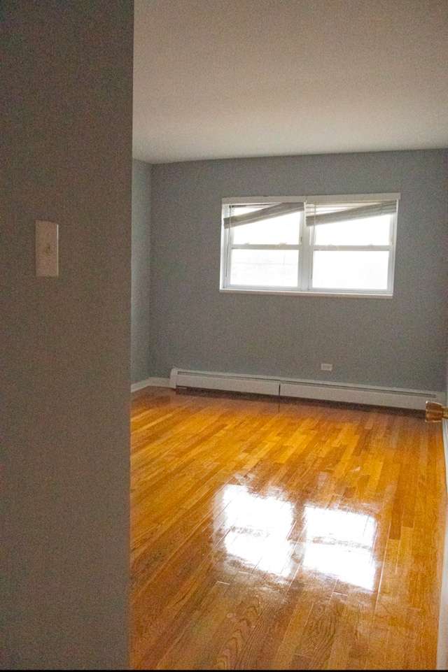 empty room featuring wood-type flooring