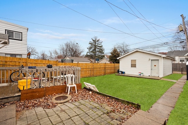 view of yard with an outbuilding and a patio