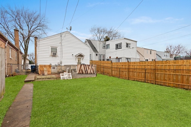 back of house featuring a lawn