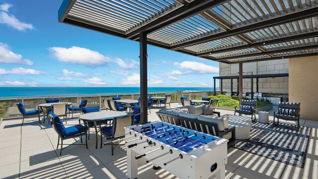 view of patio with a water view, outdoor lounge area, a pergola, and outdoor dining space