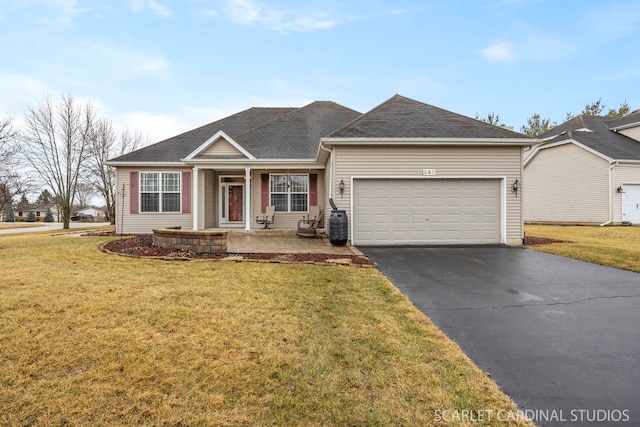 ranch-style house featuring an attached garage, covered porch, aphalt driveway, and a front lawn