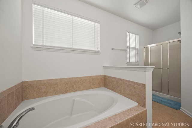 bathroom featuring a bath, tile patterned flooring, a shower stall, and visible vents