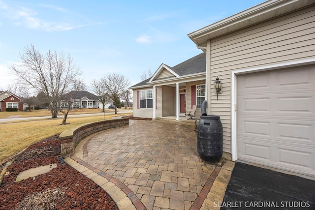 view of patio featuring an attached garage