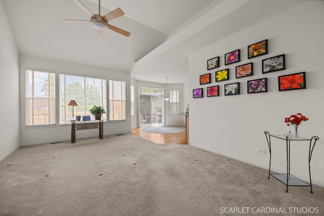 interior space featuring vaulted ceiling and ceiling fan