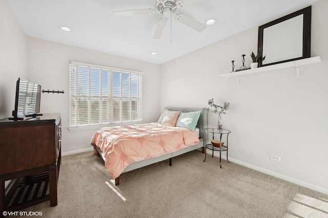 bedroom featuring ceiling fan and carpet