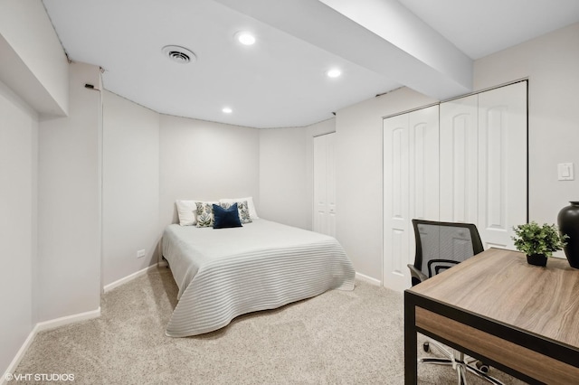 carpeted bedroom featuring a closet