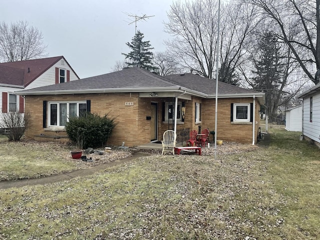 view of front of home featuring brick siding