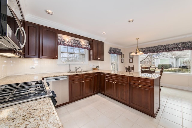 kitchen with stainless steel appliances, a sink, decorative backsplash, and ornamental molding