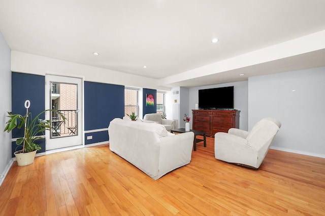 living room with light hardwood / wood-style flooring