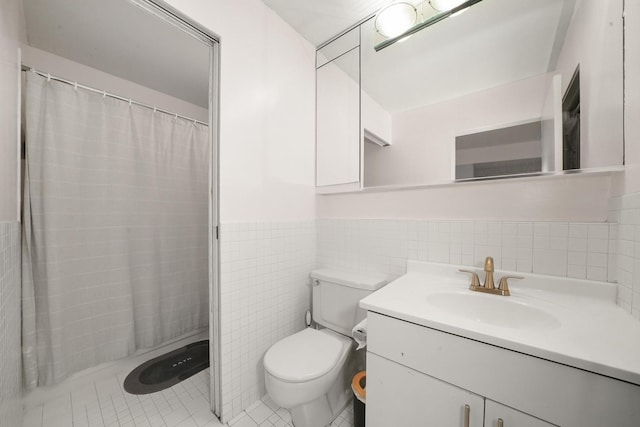 bathroom with tile patterned floors, walk in shower, vanity, tile walls, and toilet