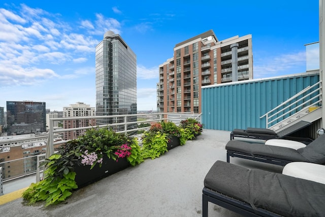 view of patio featuring a balcony