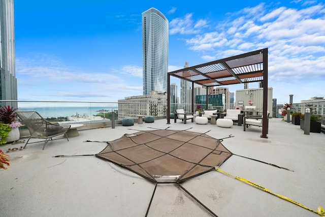 view of patio / terrace featuring a pergola and a water view