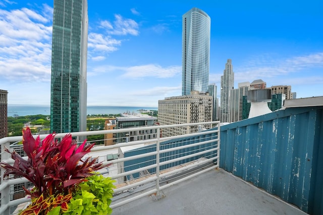 balcony featuring a water view