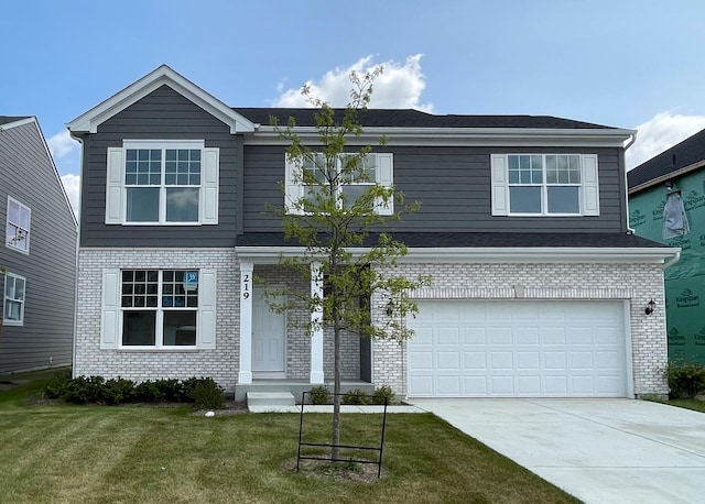 front facade with a front yard and a garage