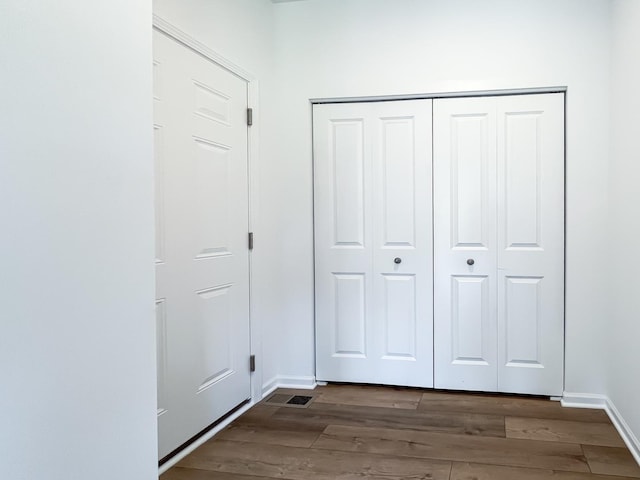 interior space with dark hardwood / wood-style floors