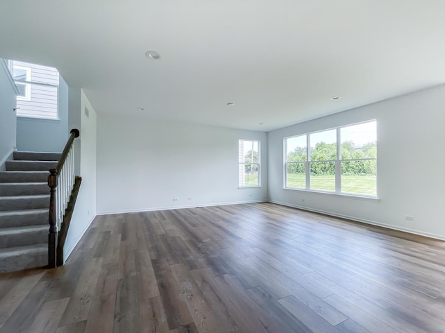 unfurnished living room featuring dark hardwood / wood-style flooring