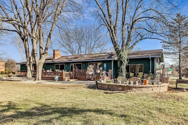 rear view of house with a yard